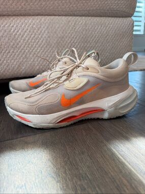 Nike Women's Beige Sneakers with Bright Orange Swoosh